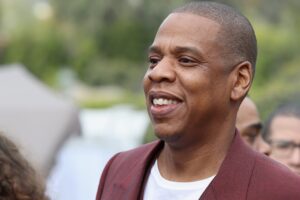 Jay-Z durante una performance live, fondatore di Roc Nation e icona dell'Hip Hop USA