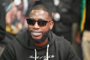 Gucci Mane in un primo piano fotografico, rapper simbolo della scena Trap
